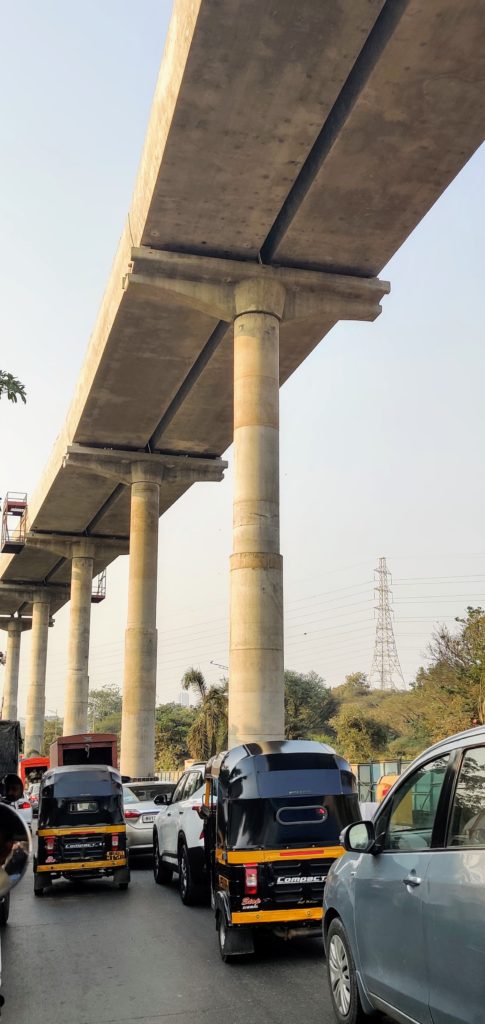 Traffic under a metro bridge