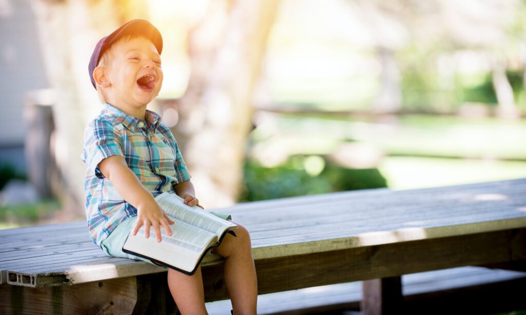 young boy reading